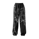 THE LOCKED IN COMFORT BAGGY TRACK PANTS
