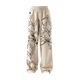 THE LOCKED IN COMFORT BAGGY TRACK PANTS